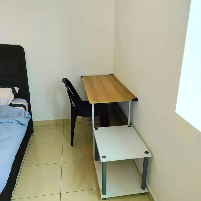 A desk and chair in one of the bedrooms