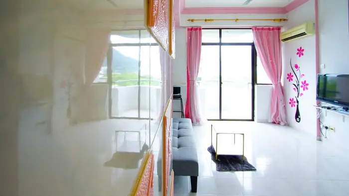 The living room at Sakura Home with the balcony doors open